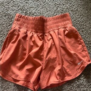 Nike Women's Athletic Shorts Orange with Silver Swoosh